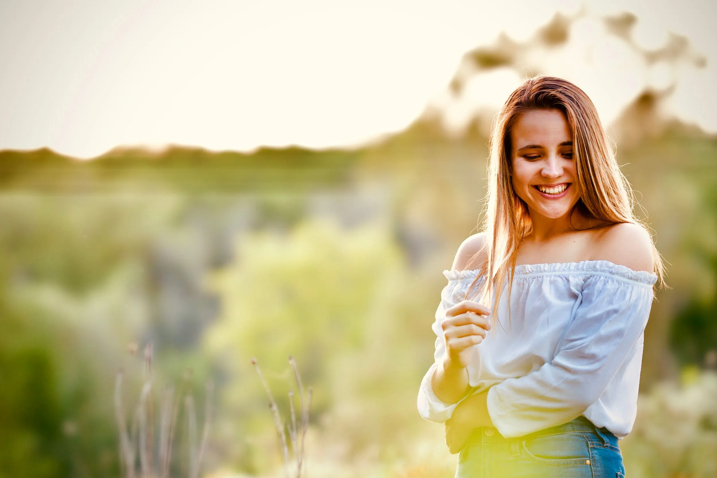 Senior portrait in a summer field